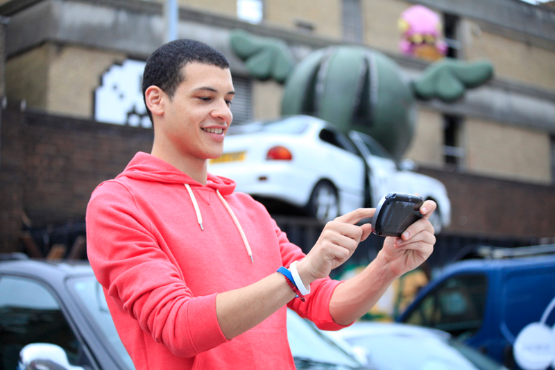 Illustration for article titled Attractive Young Men Smiling at the PlayStation Vita